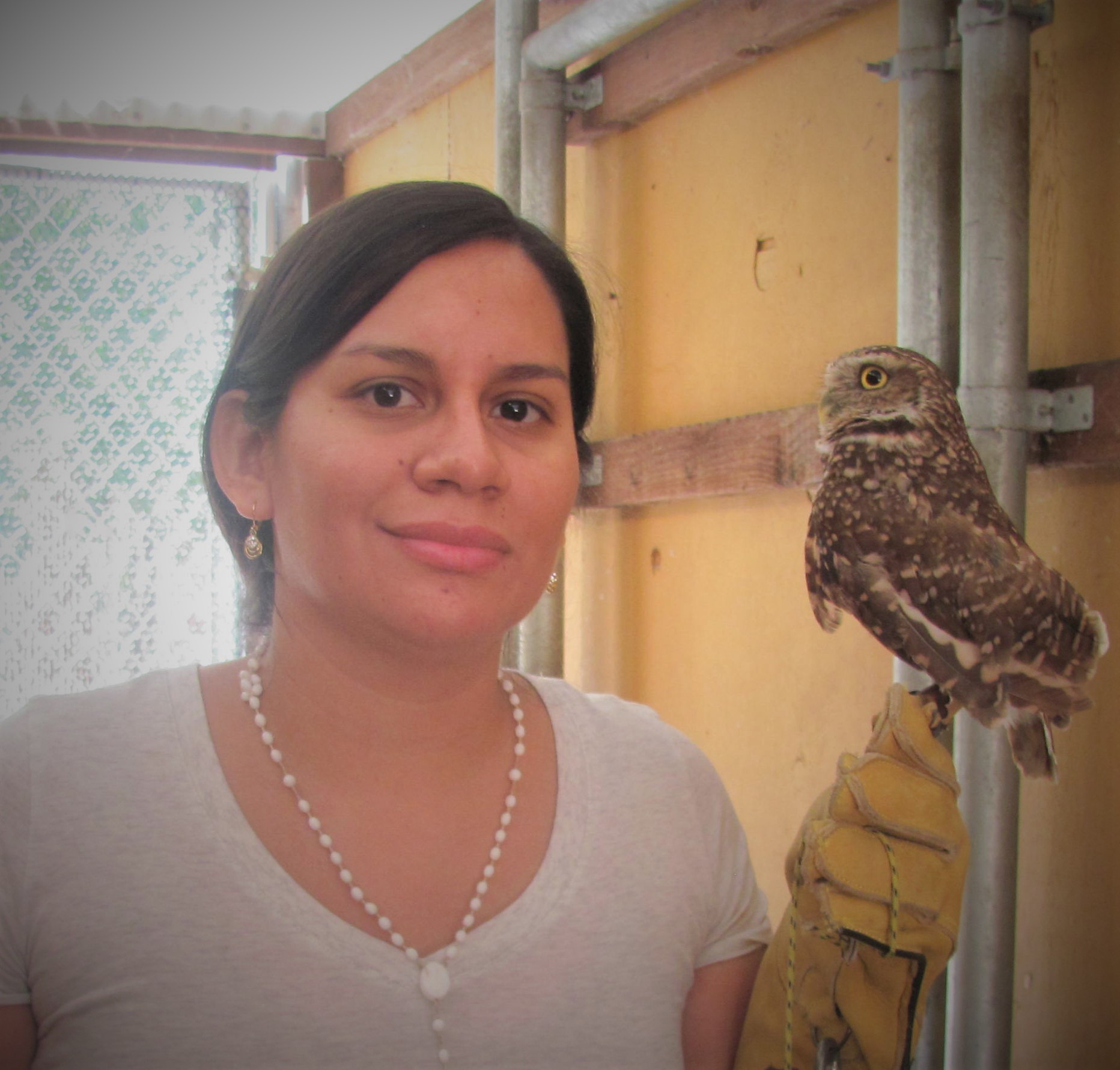 Charlene Lujan-Vega with a burrowing owl